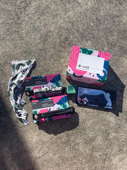 happy runners gift pack with two sports fanny packs to hold any phone, a running head band, sports socks and soap